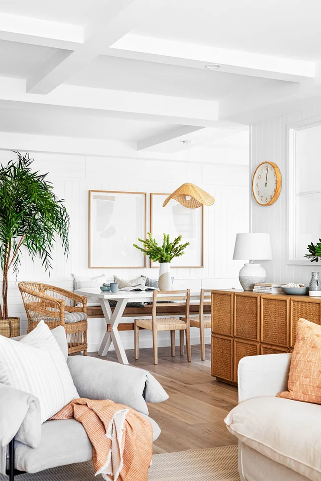 All white coastal apartement with rattan accents