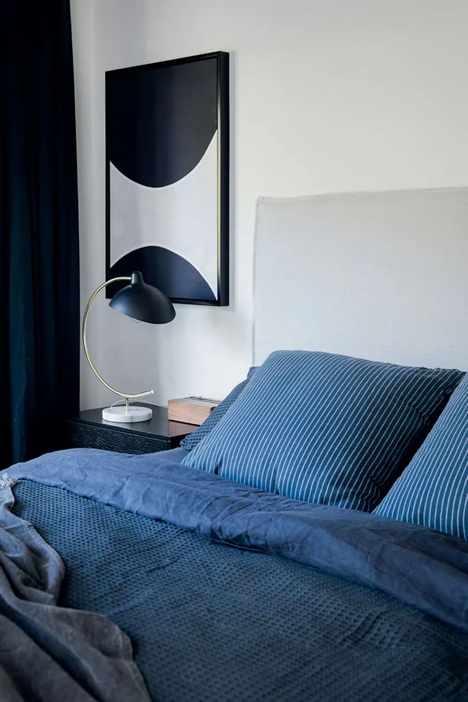 Benji Marshall bedroom with striped blue linen