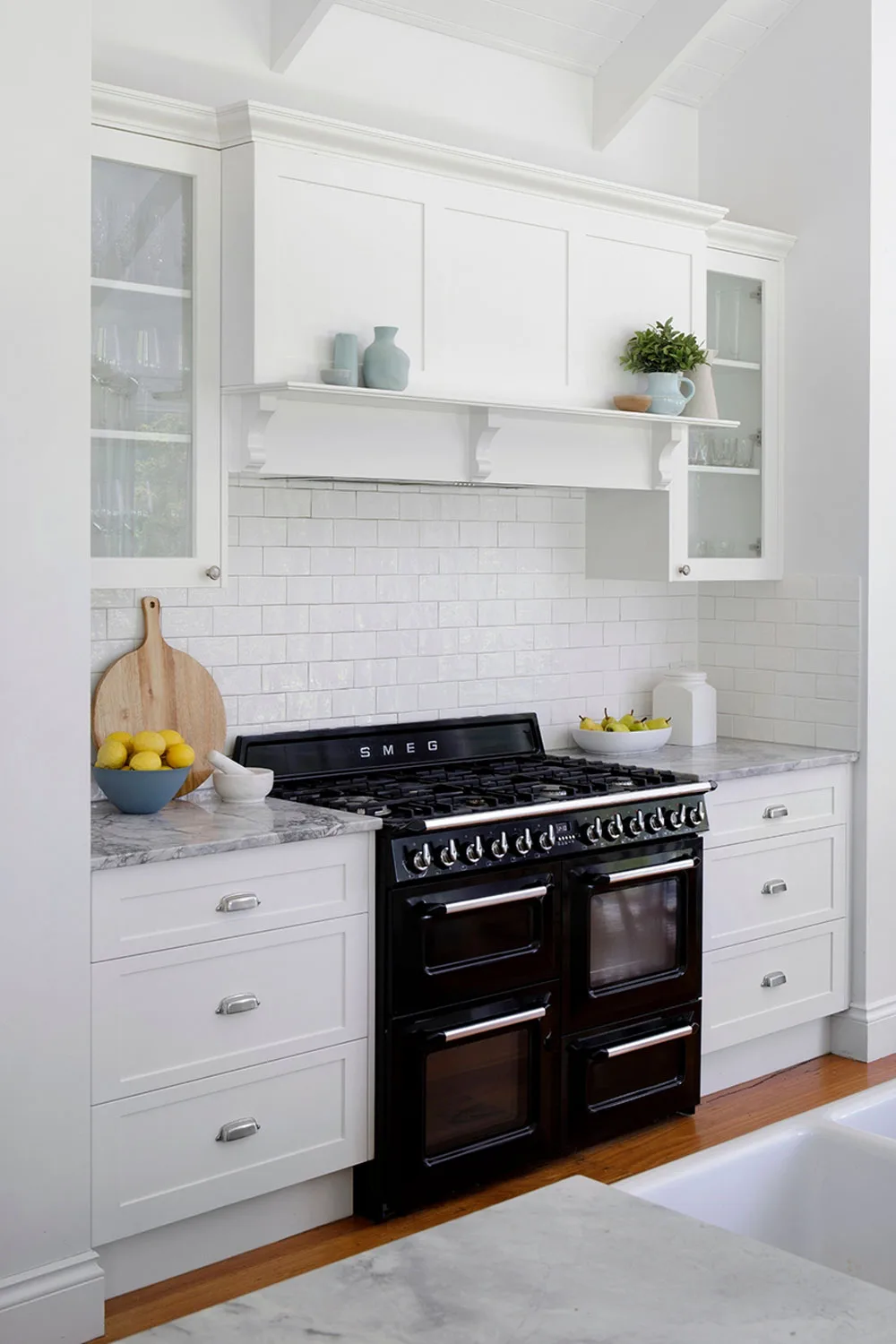 Hamptons style kitchen with black freestanding oven