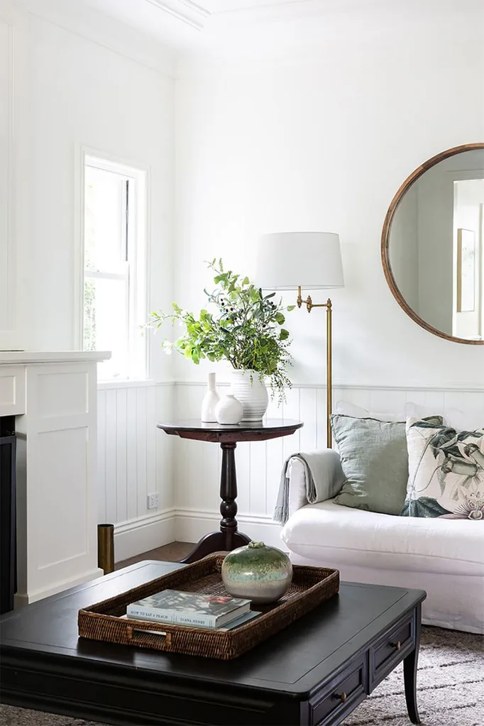 Hamptons living room with floral arrangement on side table