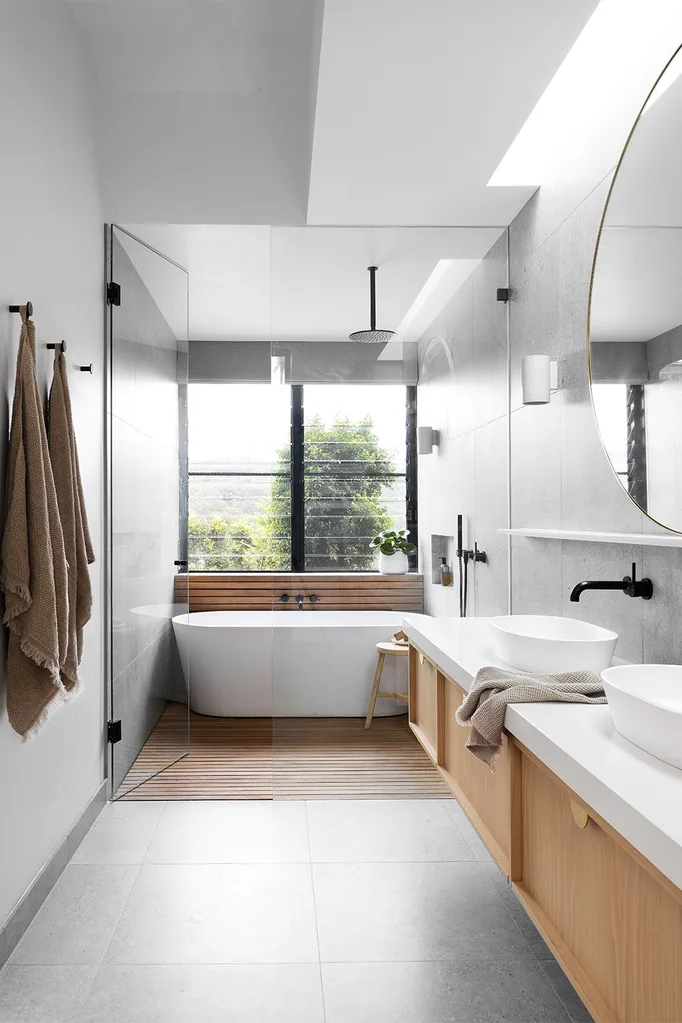 contemporary bathroom with a combination of timber and tiled walls