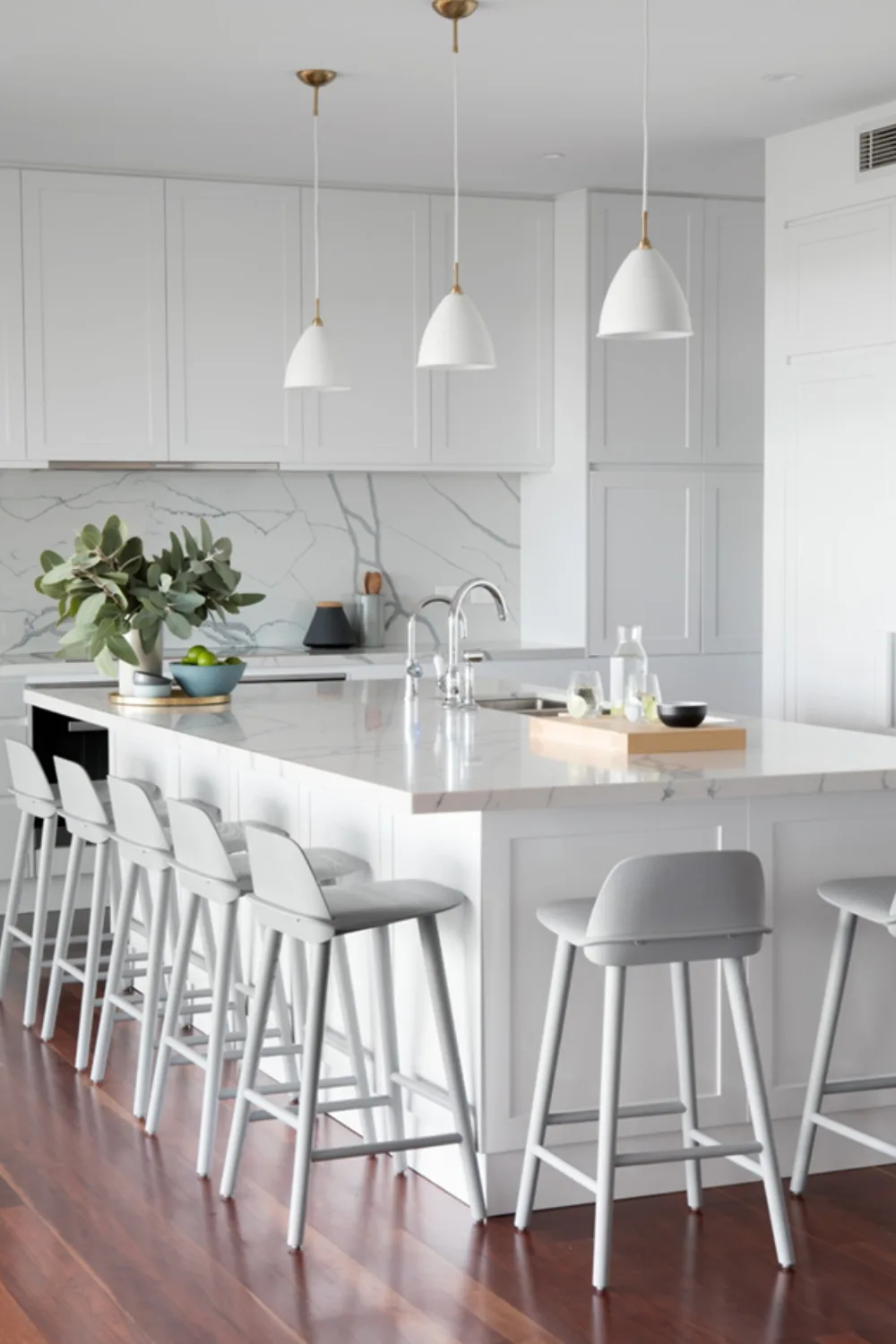 White and engineered stone kitchen with plenty of seating