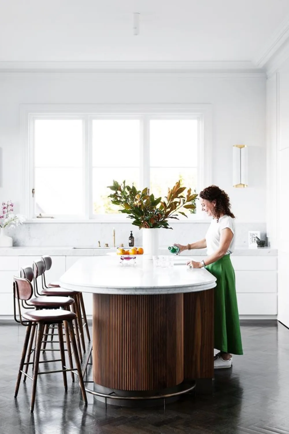 White and timber kitchen with curved island bench