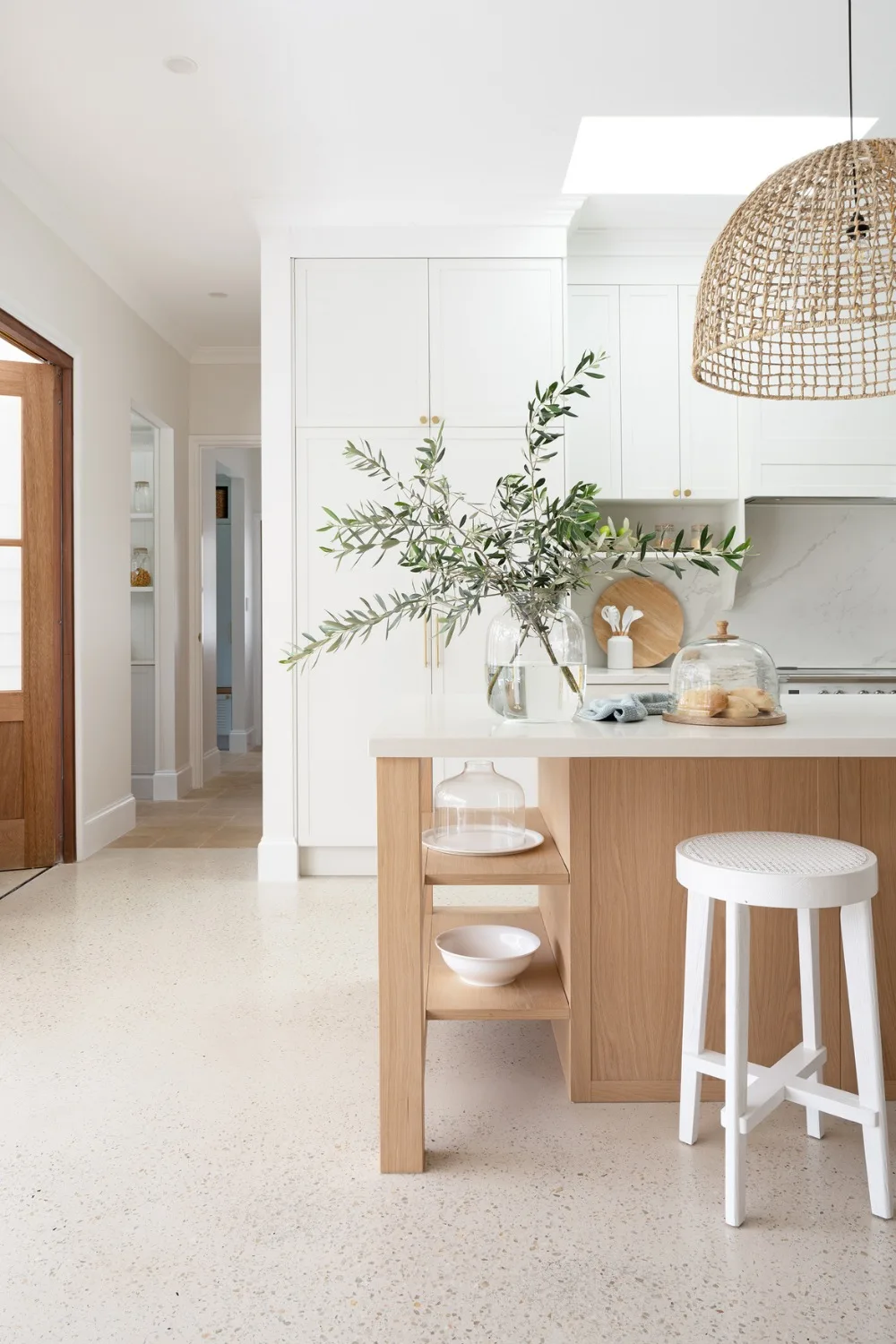 Coastal farmhouse kitchen with polished concrete floors