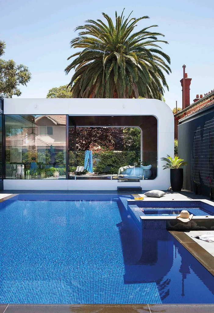 Exterior of modern curved timber pool cabana