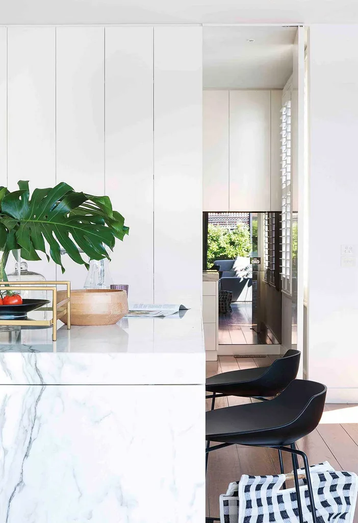 White modern kitchen with concealed butlers pantry