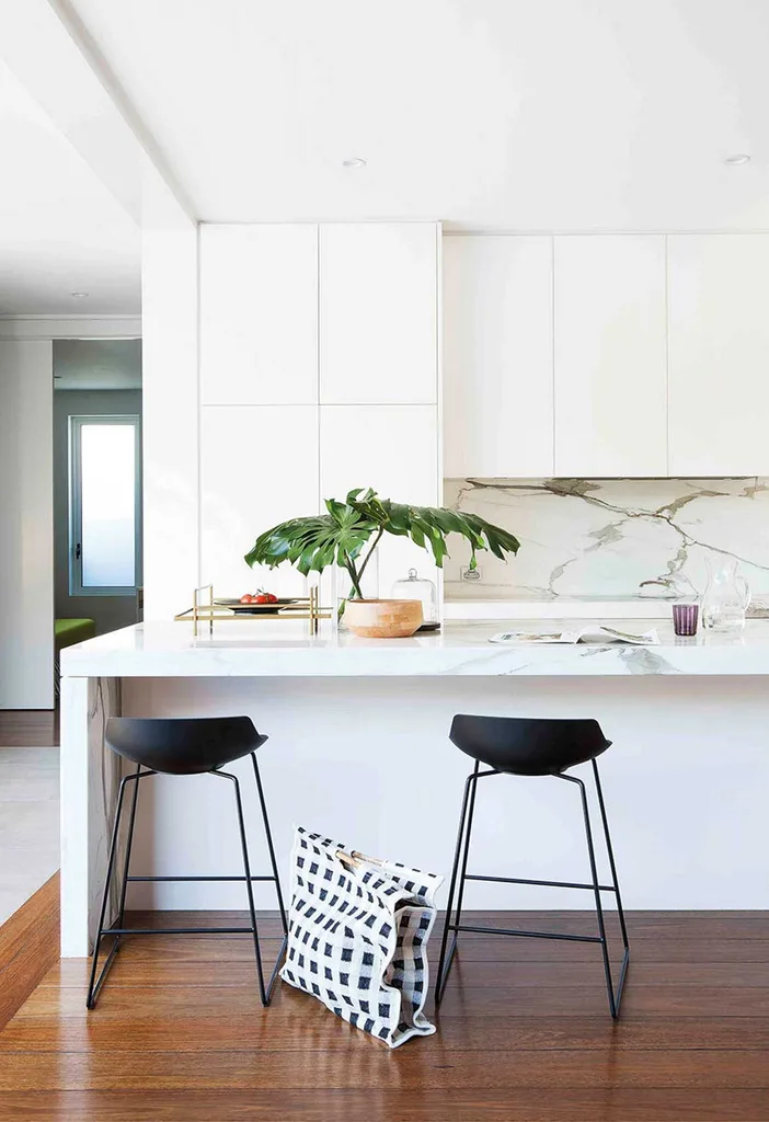 White modern kitchen with marble splashback