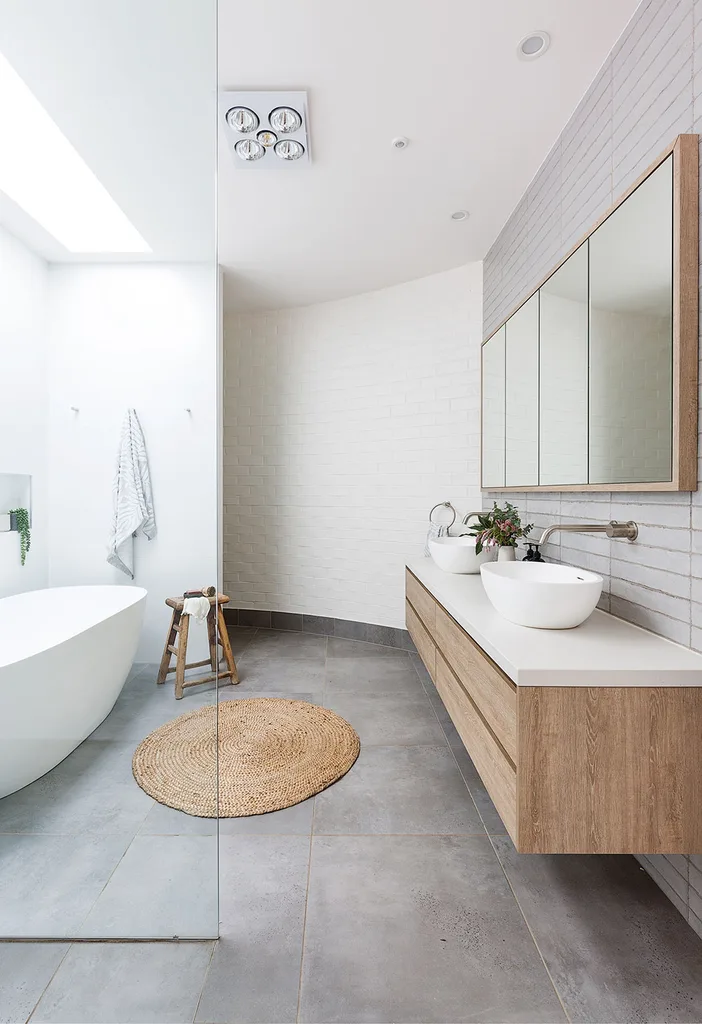 White and timber bathroom with curved brick wall