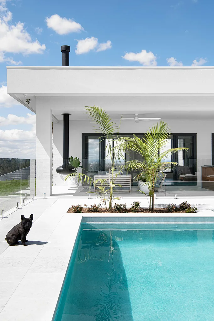 White home exterior with swimming pool in foreground