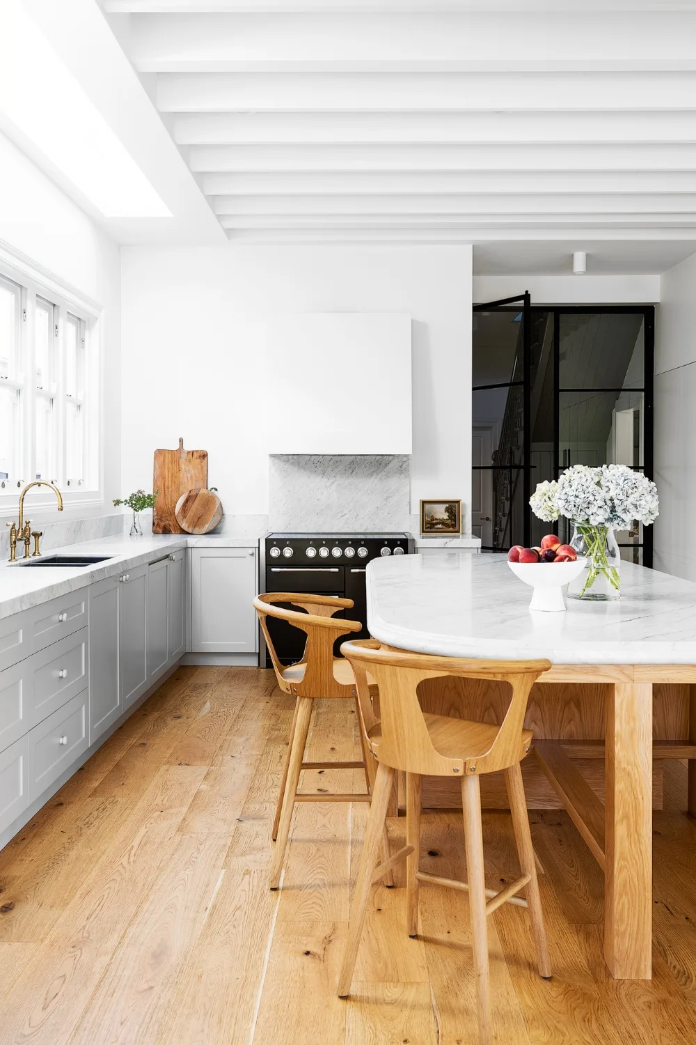 Modern white kitchen with curved island bench