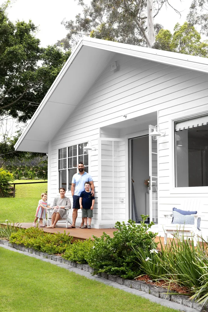 white home exterior family