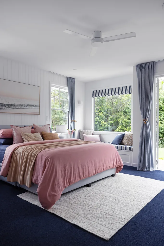pink main bedroom with window seat