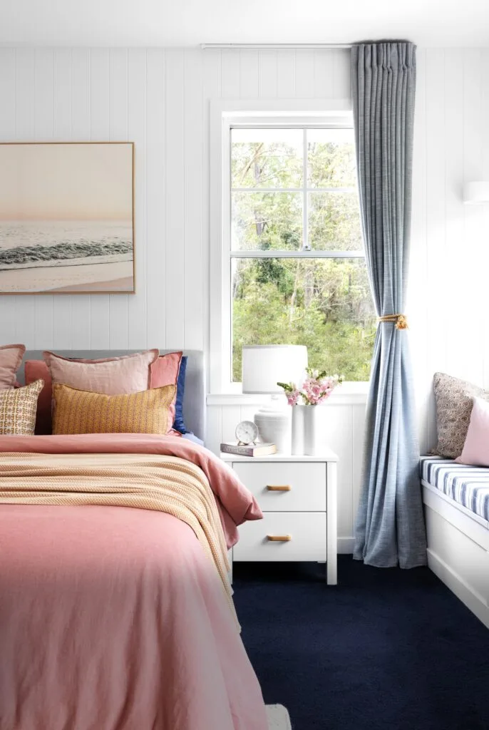 pink main bedroom with window seat