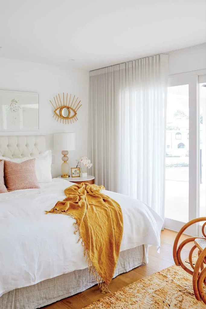 Bedroom with floor to ceiling sheer curtains