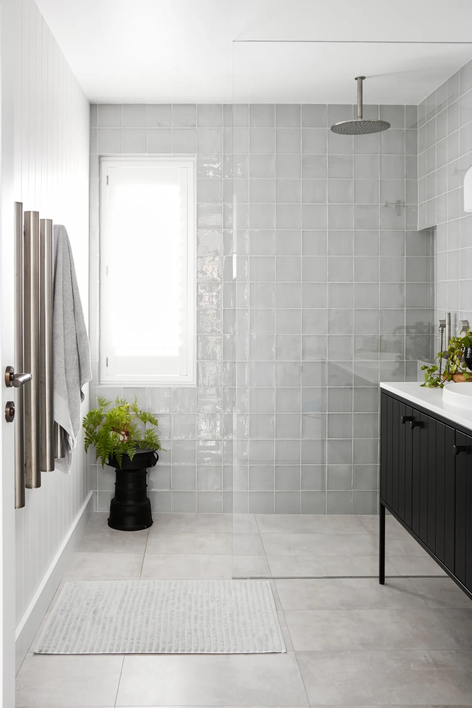 bathroom with grey shower tiles