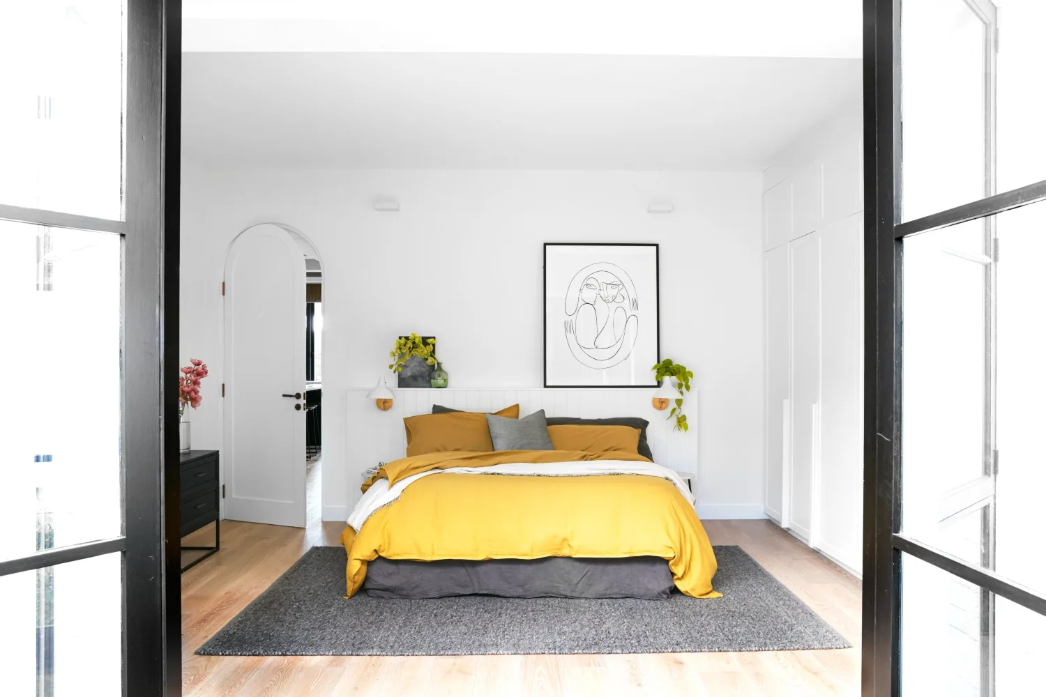 main bedroom with grey and yellow accents