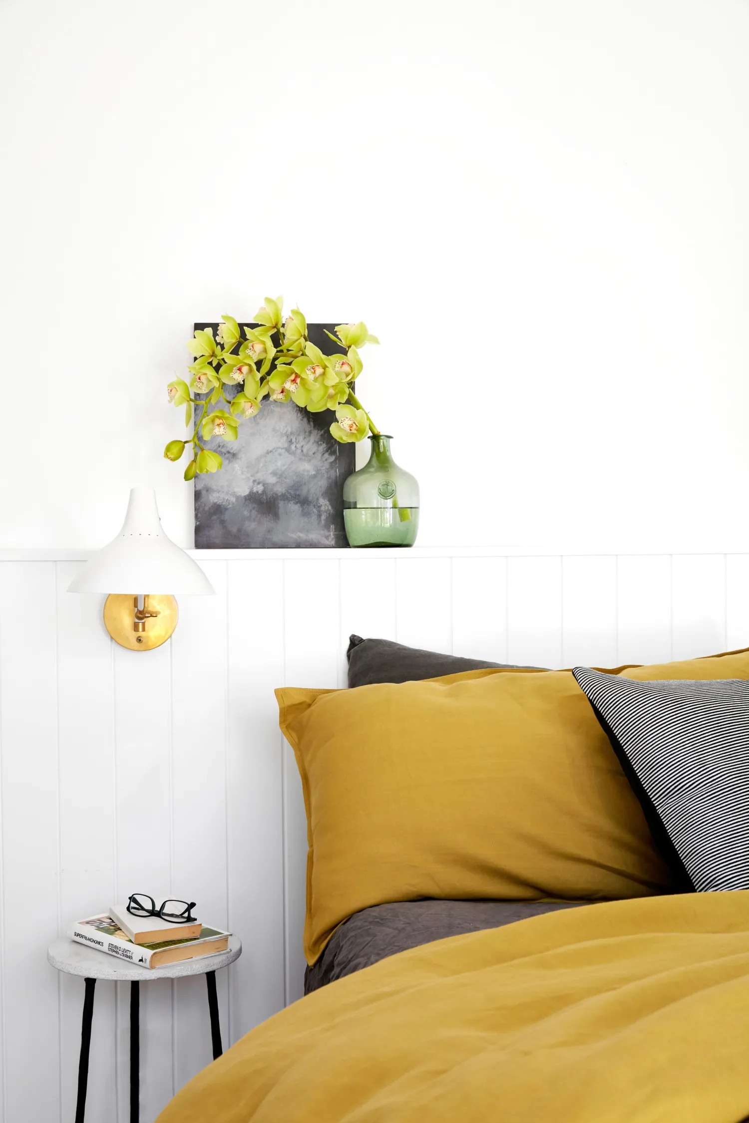 main bedroom with yellow and grey bedding