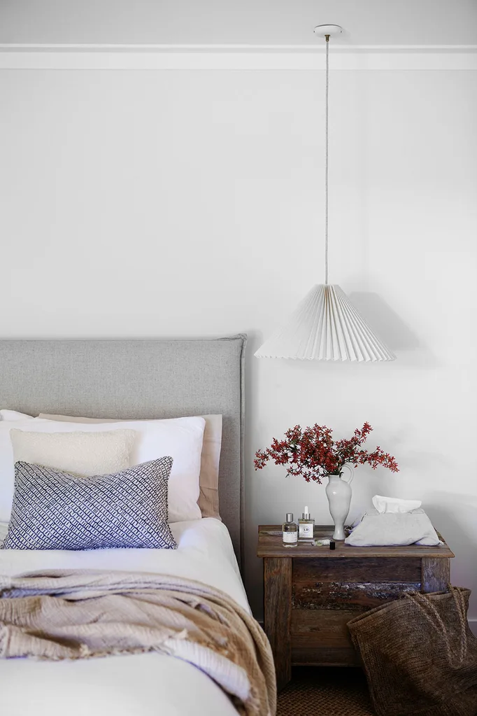 Simple and elegant bedroom with hanging pleated pendant lamp shade