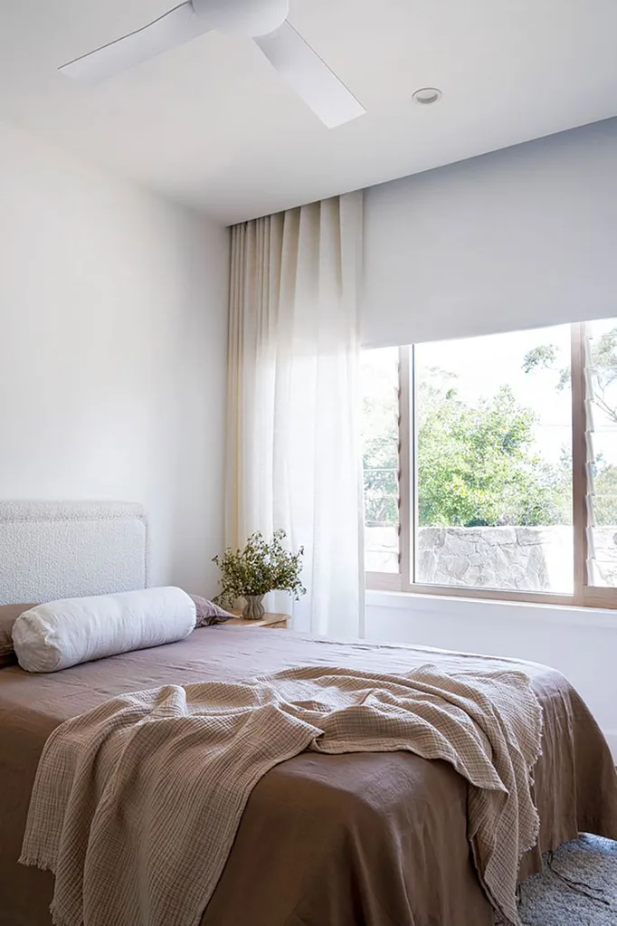 Simple bedroom with neutral toned bedding