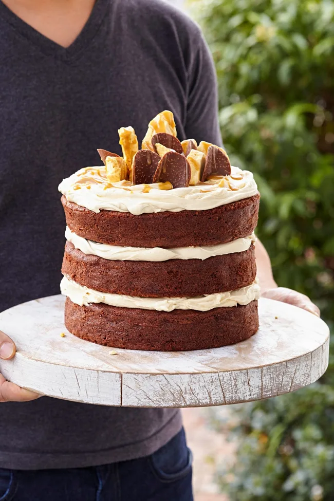 Chocolate caramel celebration cake with layers of caramel frosting