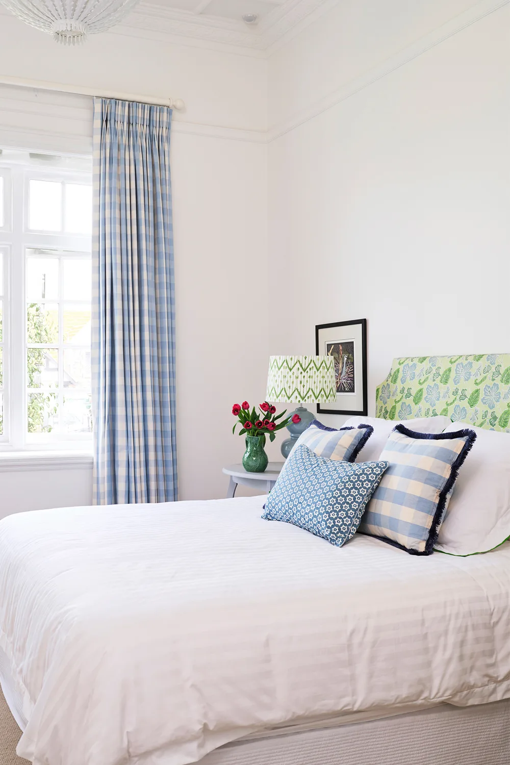 bedroom with blue and white gingham curtains