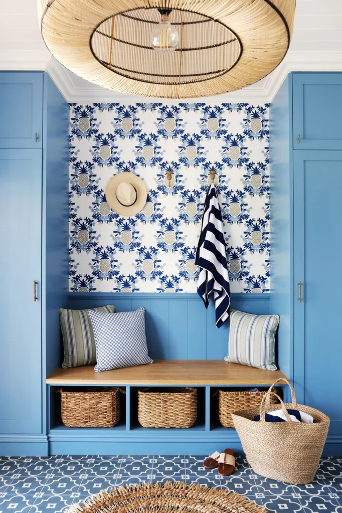 classic coastal blue mudroom with pineapple wallpaper