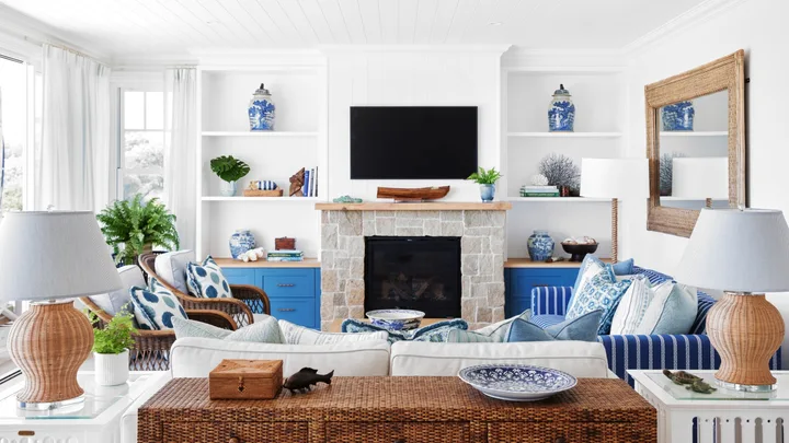 coastal blue and cream living room with sandstone fireplace