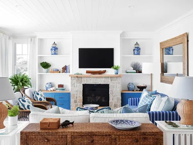 coastal blue and cream living room with sandstone fireplace