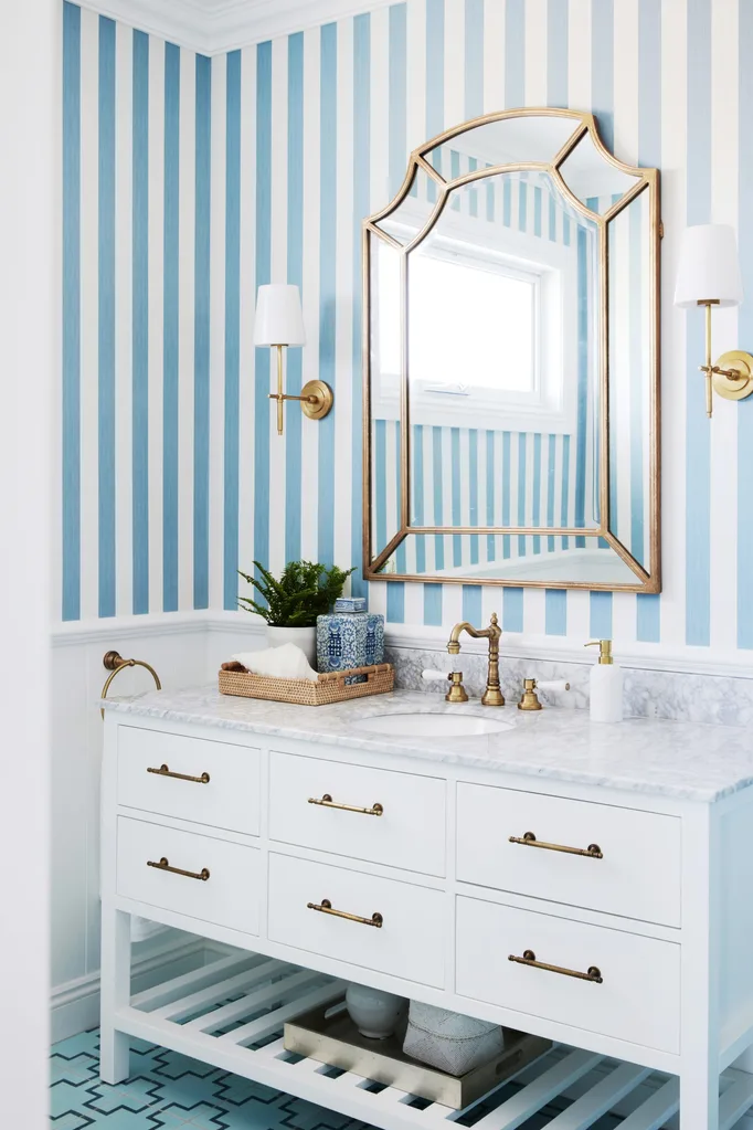 classic coastal bathroom with blue stripe wallpaper