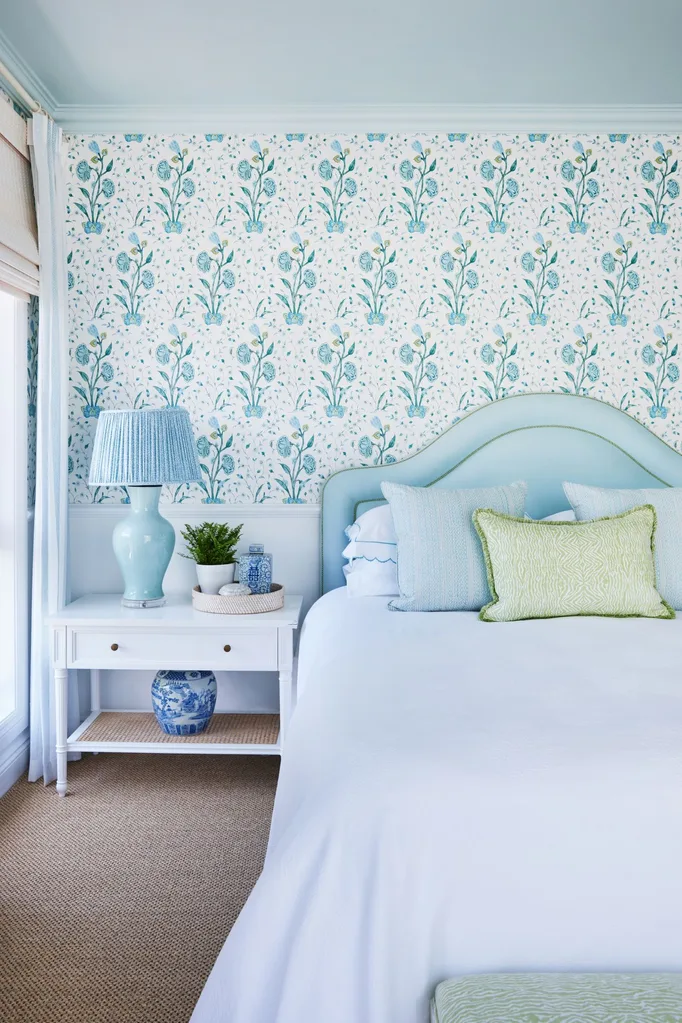 main bedroom with light blue floral wallpaper