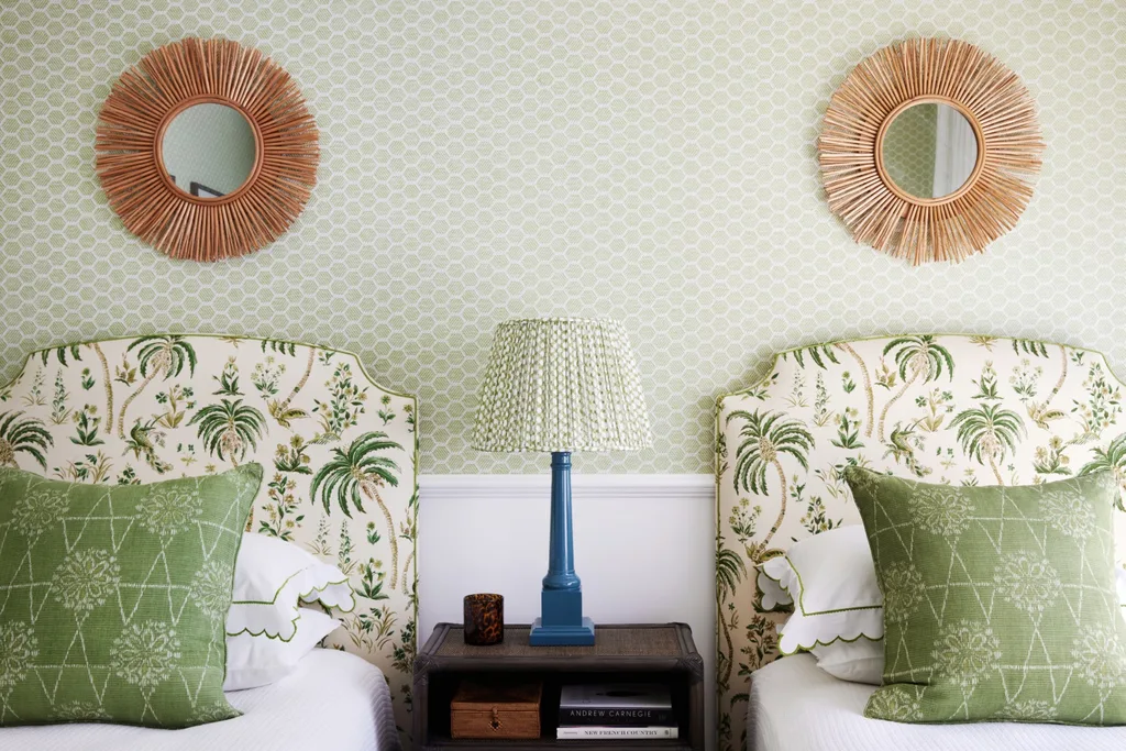 twin bedroom with palm tree print upholstered bedheads