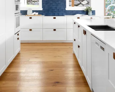 White shaker kitchen with blue tiled splashback