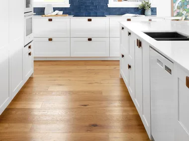 White shaker kitchen with blue tiled splashback