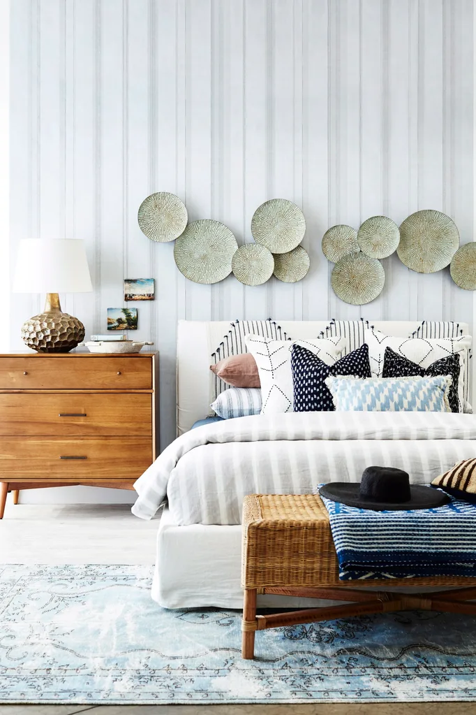 guest bedroom with abstract art above bed