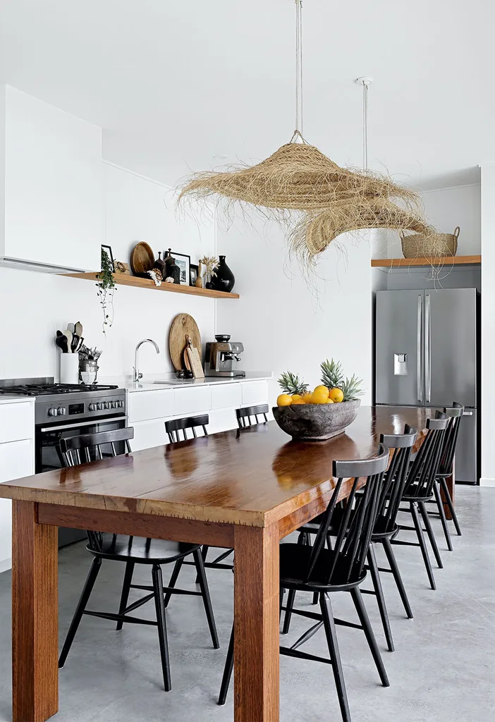 Coastal galley kitchen with large dining table