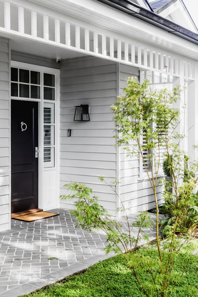 hamptons home facade with black front door