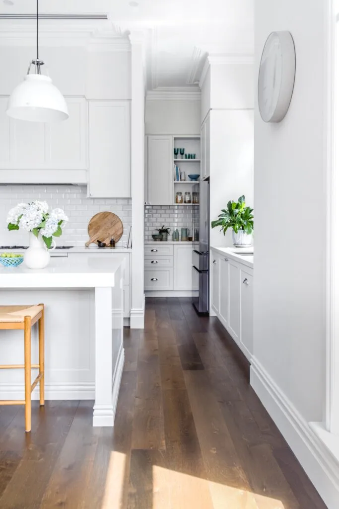 white hamptons kitchen with white subway tiles splashback