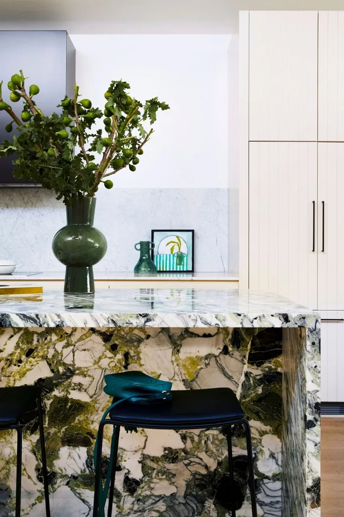 Modern kitchen with green marble island bench