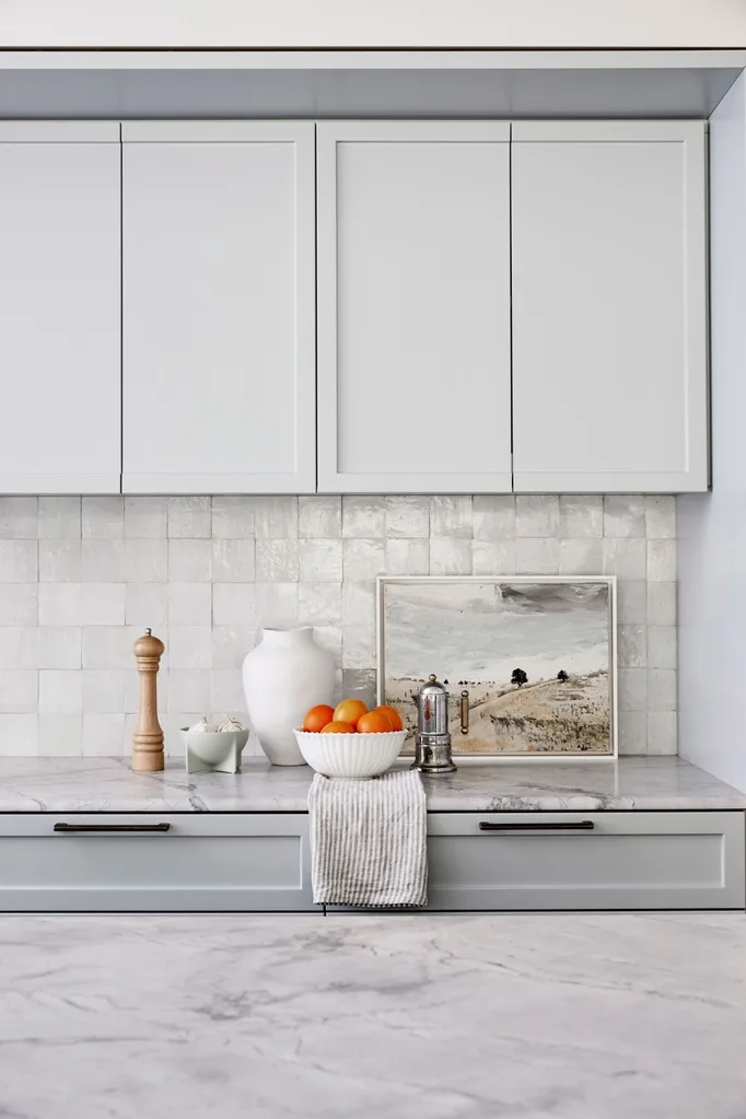 Grey and marble kitchen with square tile splashback