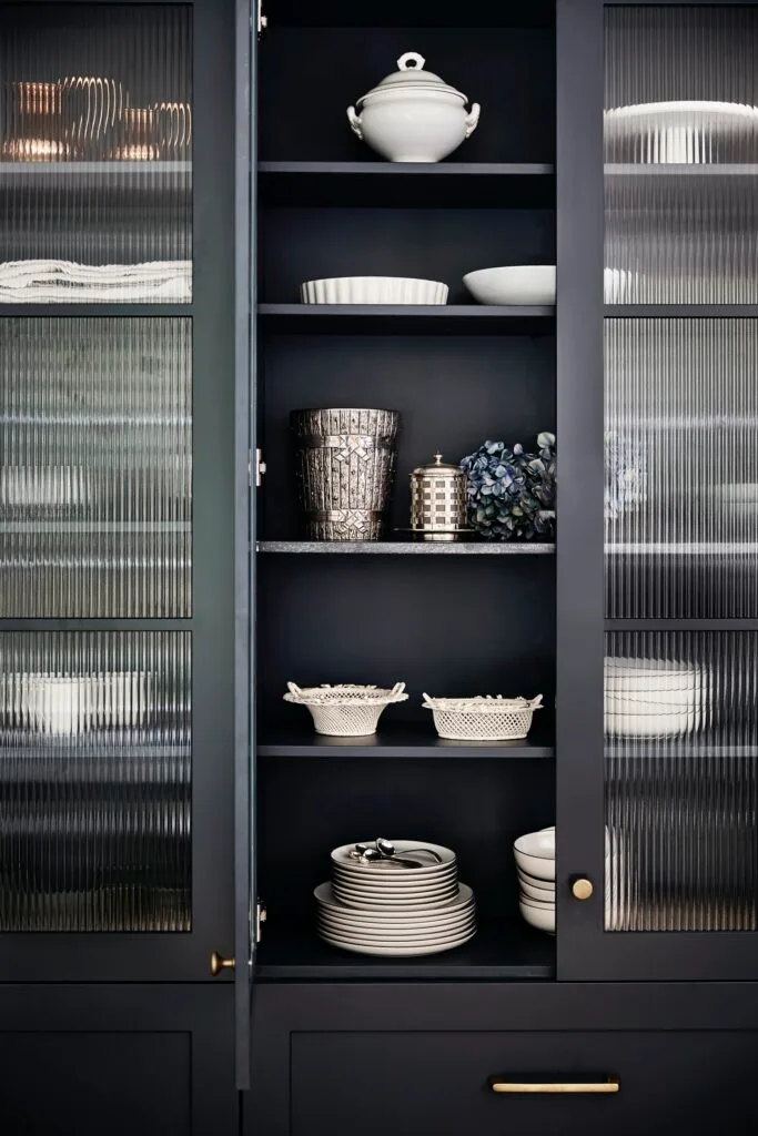 black cabinet with fluted glass