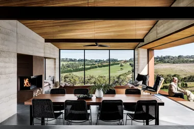 open plan dining and living area with timber clad ceiling