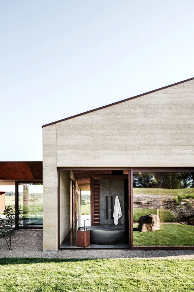 Bathroom with freestanding concrete bath