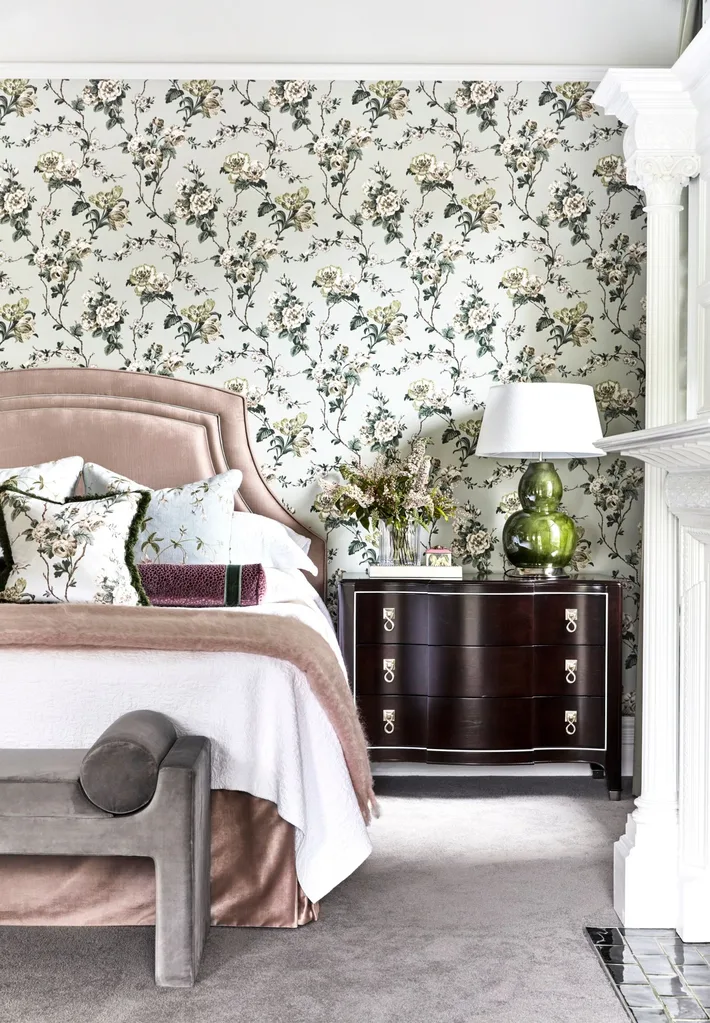 velvet pink bed with floral wallpaper