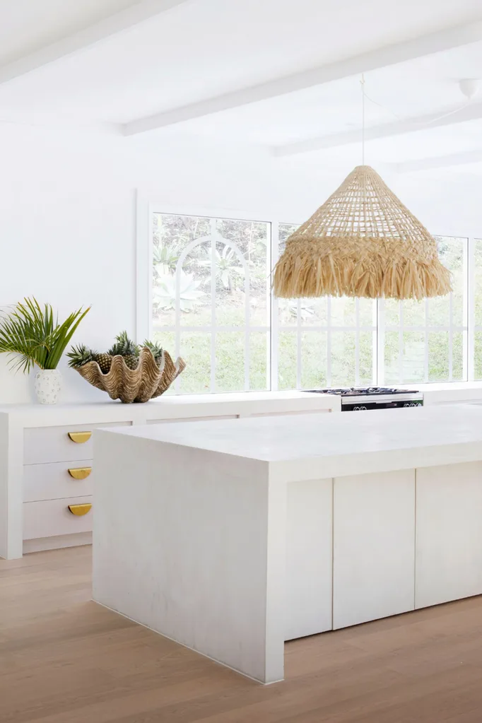 Three Birds Renovations kitchen with concrete kitchen island bench