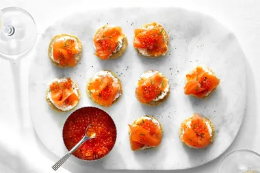 Smoked salmon blinis with whipped ricotta and chives