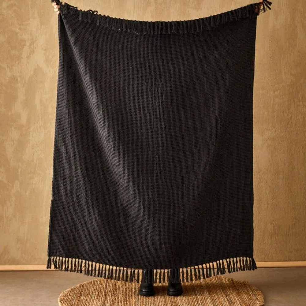 BLack throw rug with tassels