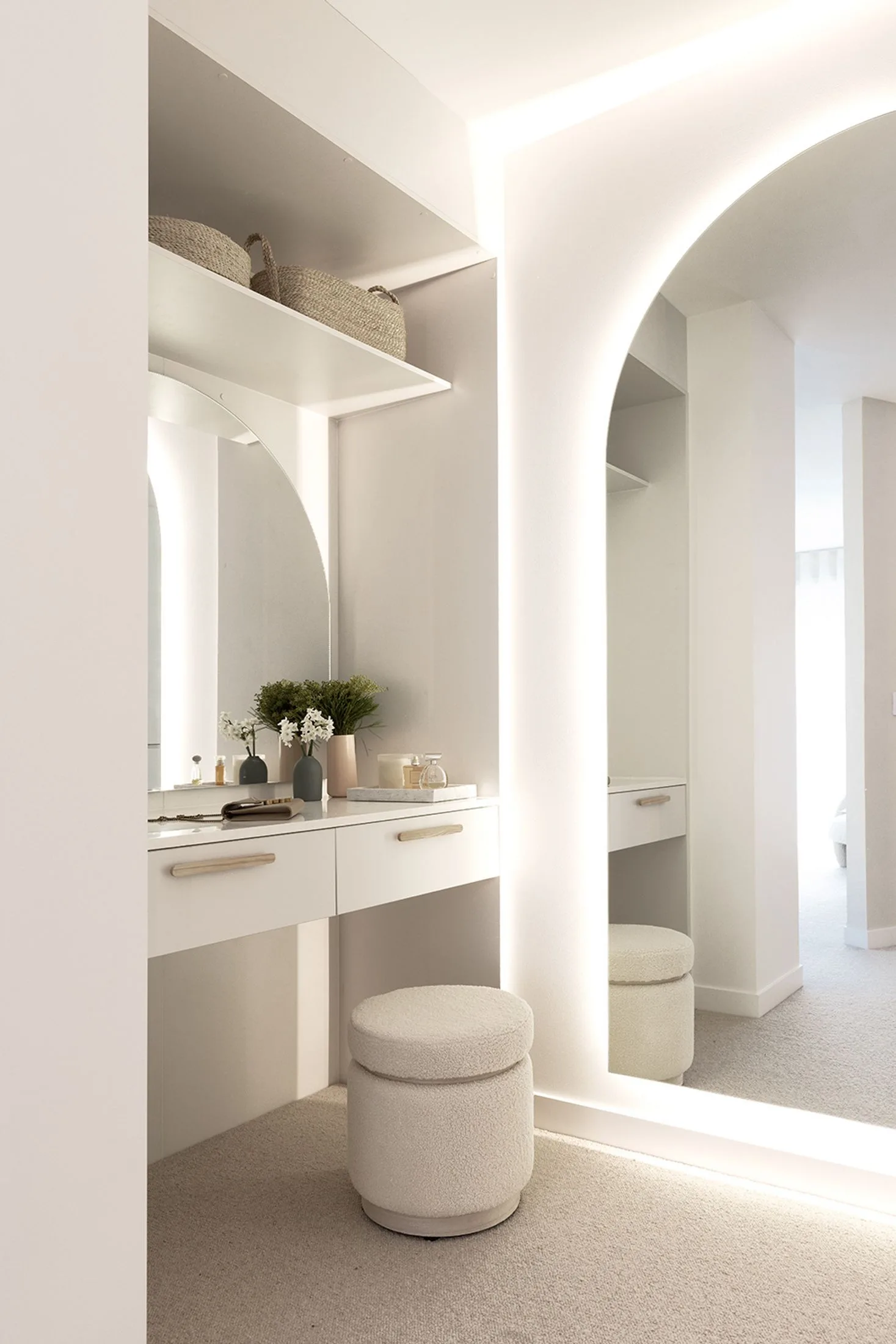 A light and bright makeup station and dressing table in a walk-in robe