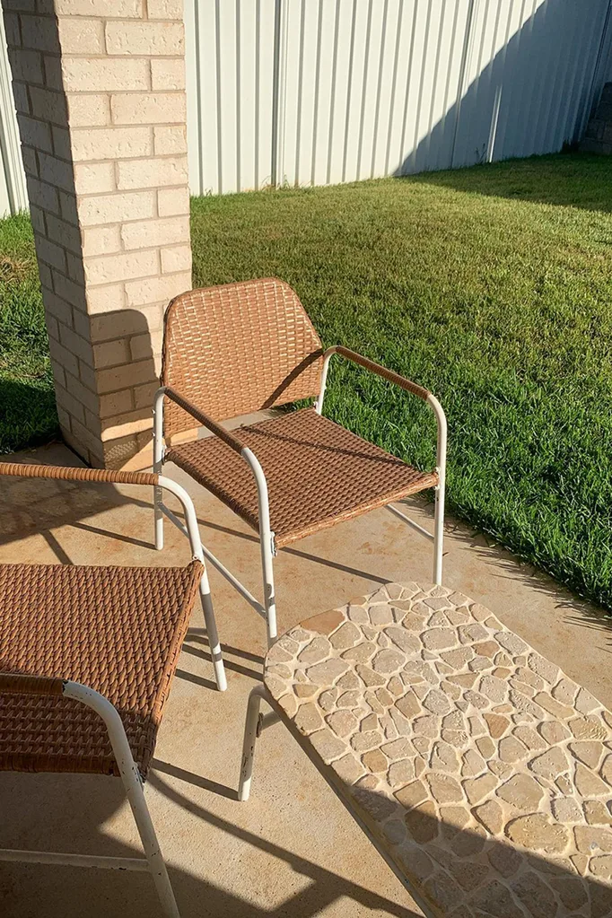 Outdoor table tiled with Kmart's stone decking tiles