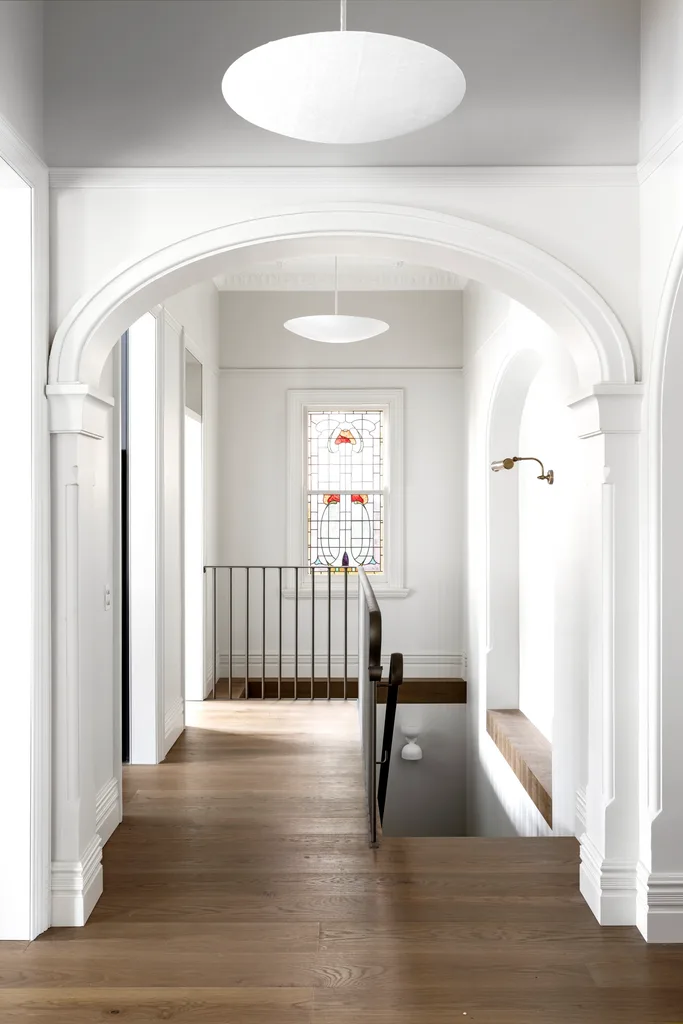 staircase with leadlight windows