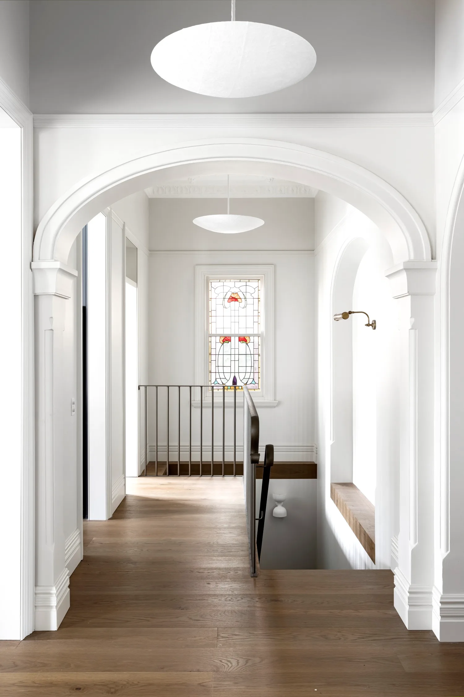 staircase with leadlight windows